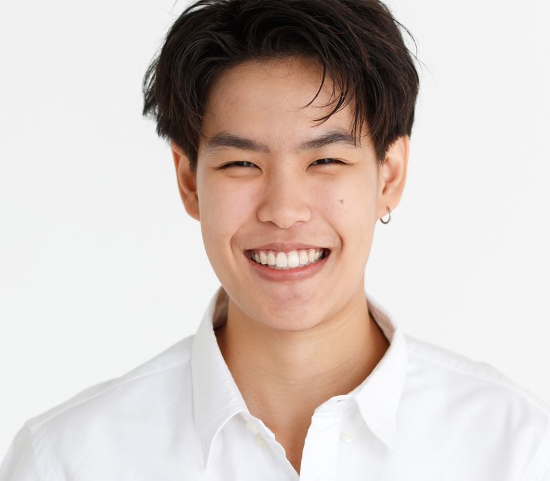 transitional aesthetics patient model in a white button up shirt