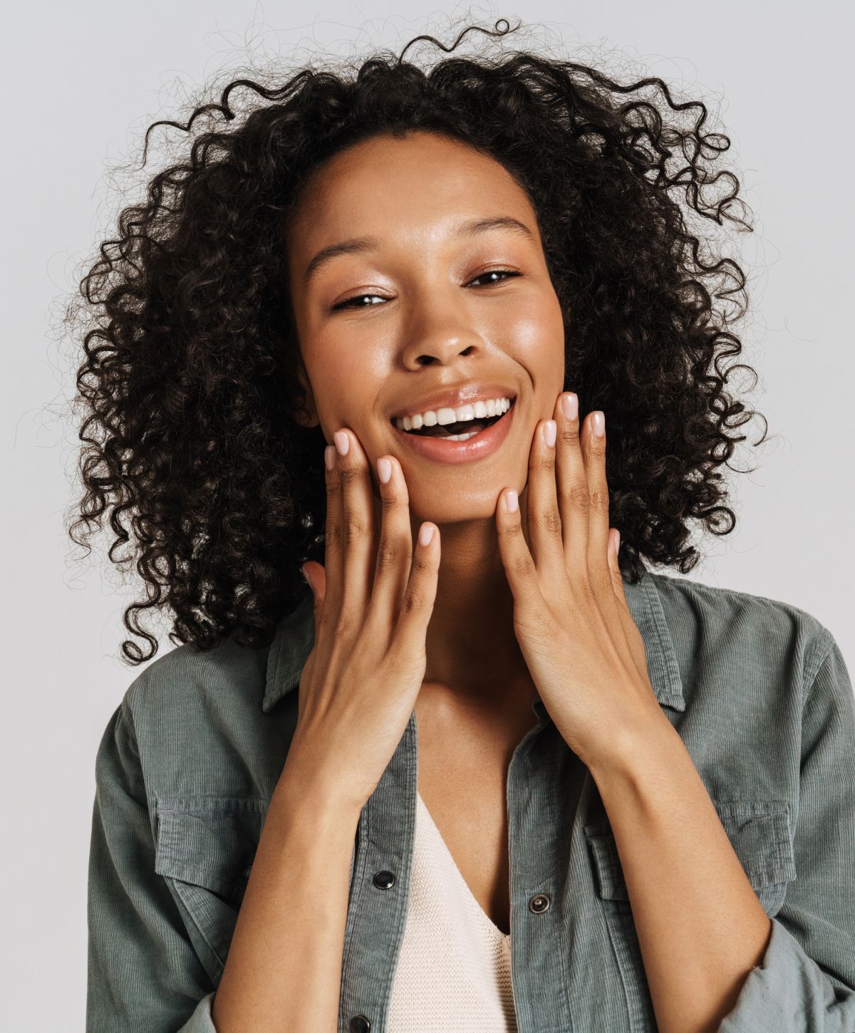 Keravive patient model smiling and touching her face